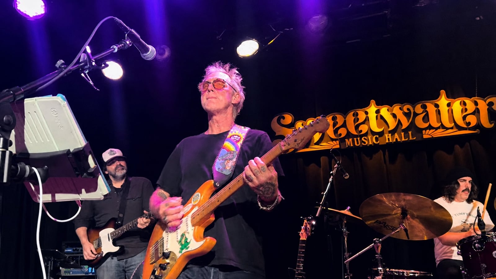 Nathan Dale playing electric guitar with Anders Osborne at Sweetwater Music Hall in December 2025