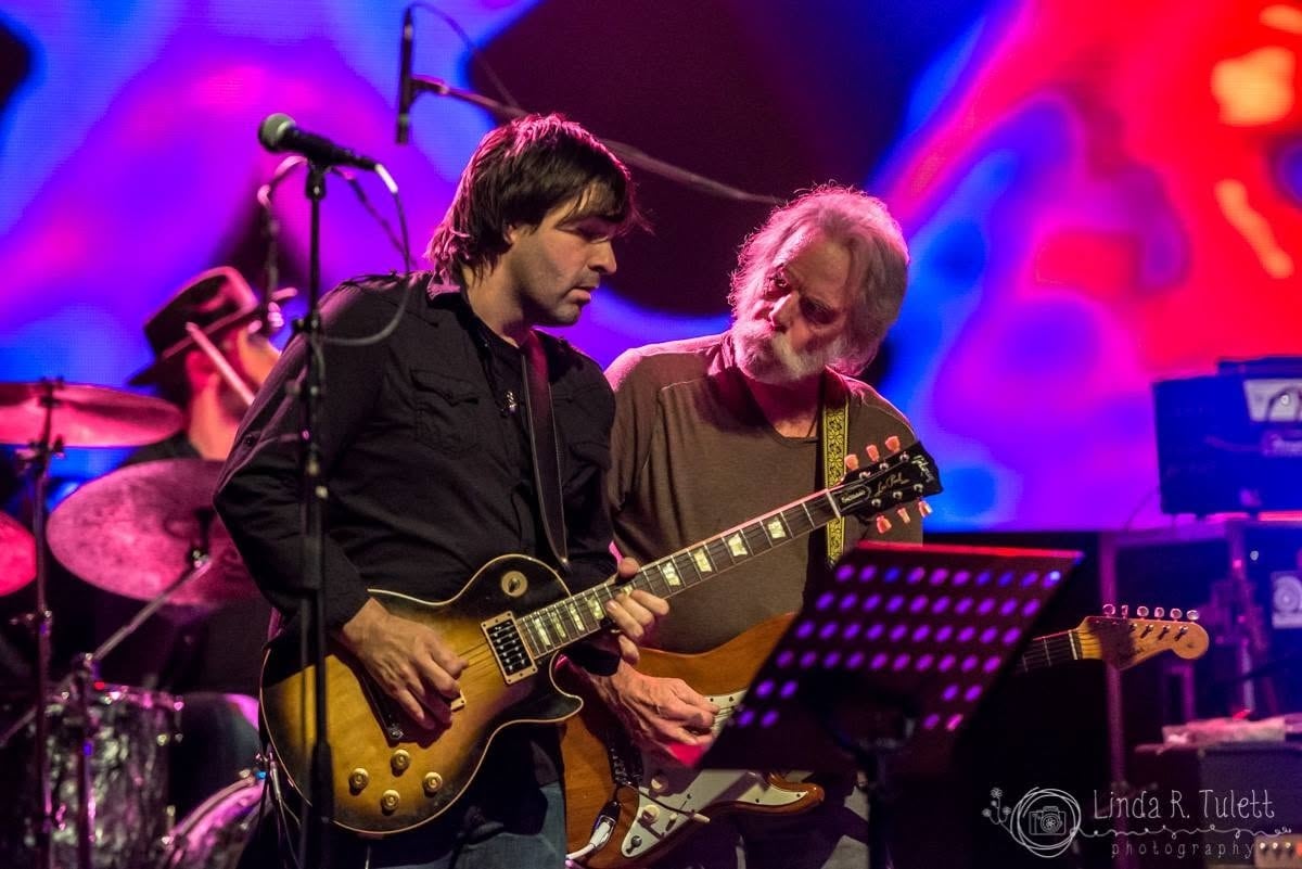 Nathan Dale and Bob Weir playing electric guitars together during Jackie Greene's birthday show at The Warfield in 2016