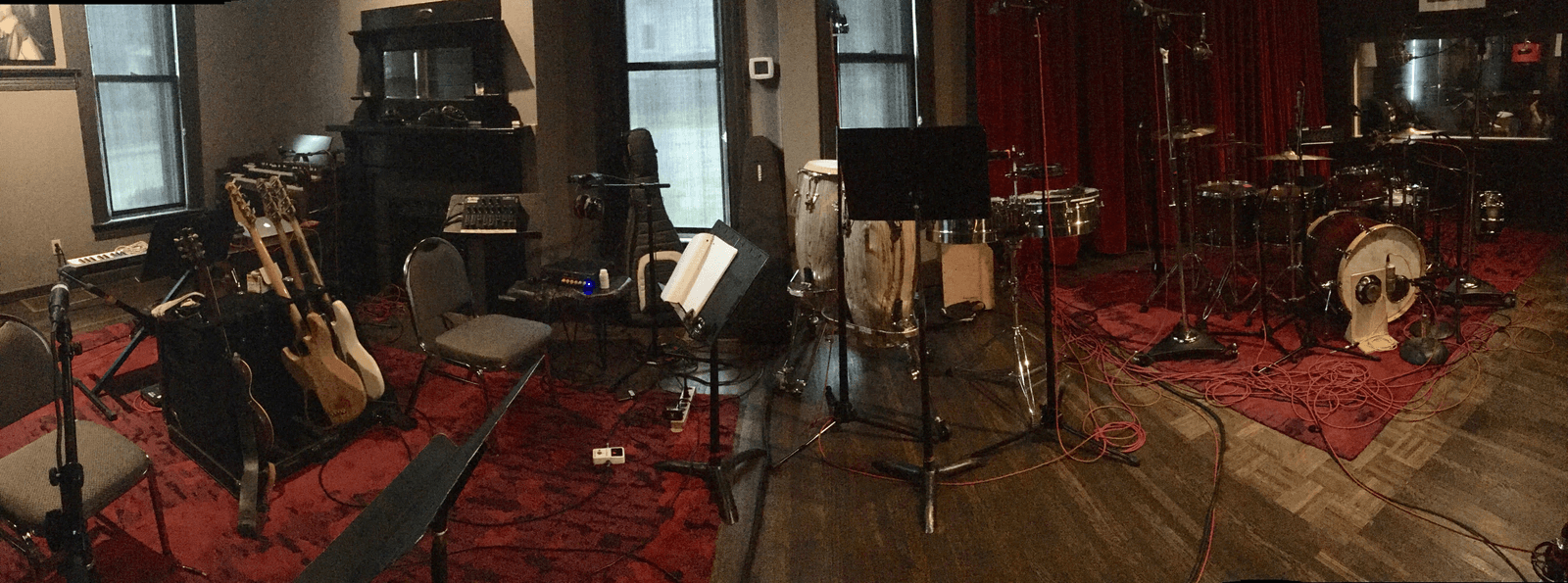 Panoramic view of instruments, microphones, percussion, cables, and the live room at Sienna Studios Nashville in 2018