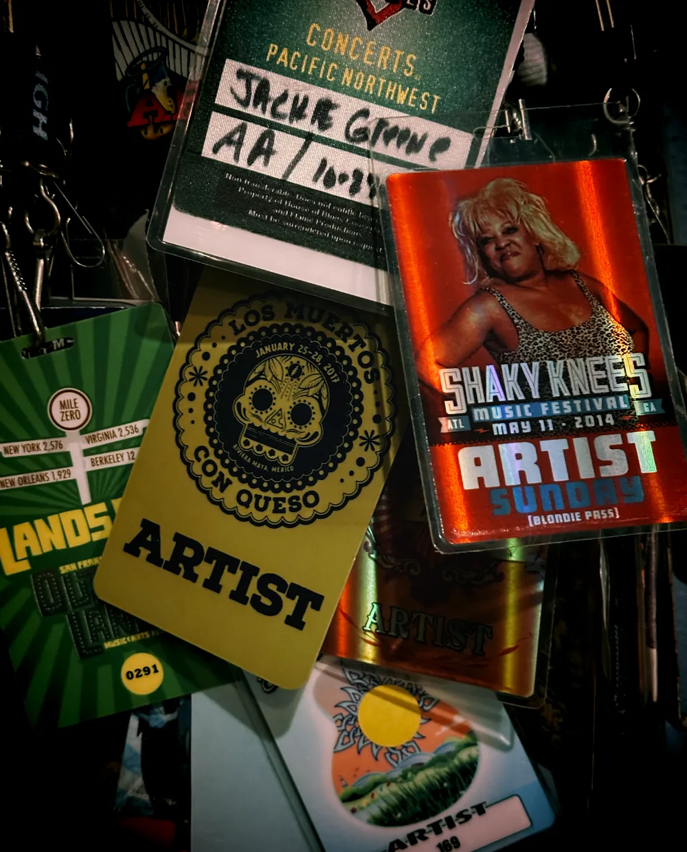 A collection of Nathan Dale's touring and artist passes from years on the road